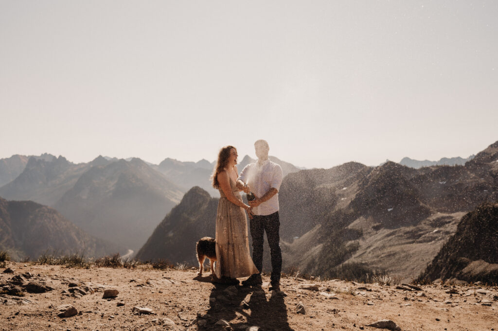 couple sprays champagne after surprise proposal in washington