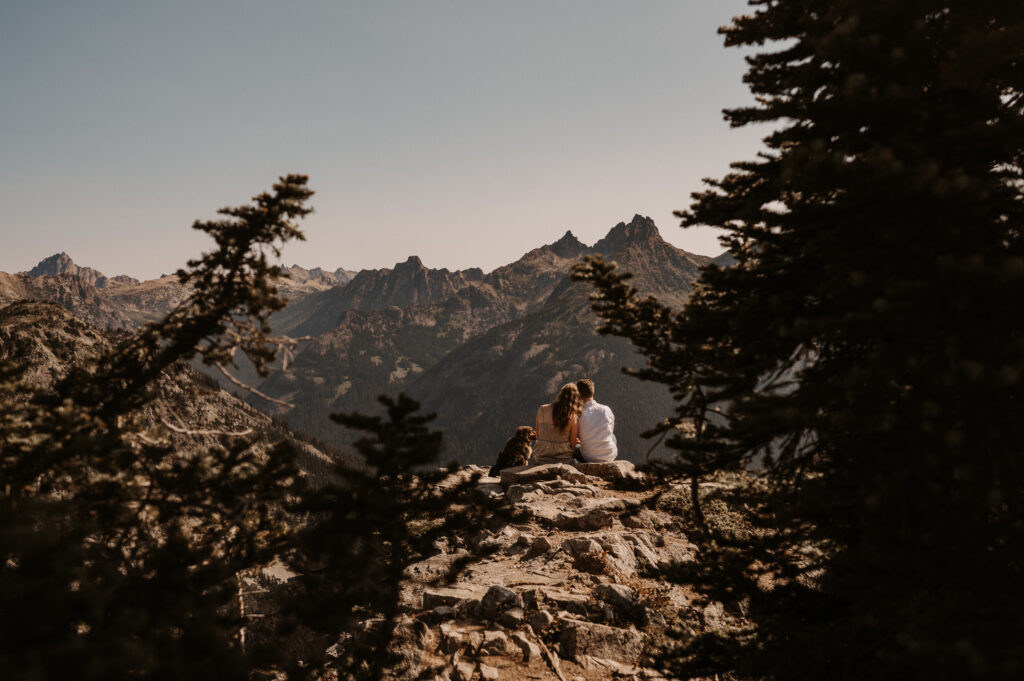 couple leans on each other looking at north cascade range