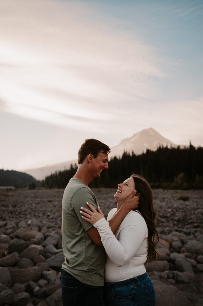 Couple laughing during engagement photos near Mount Hood, Oregon