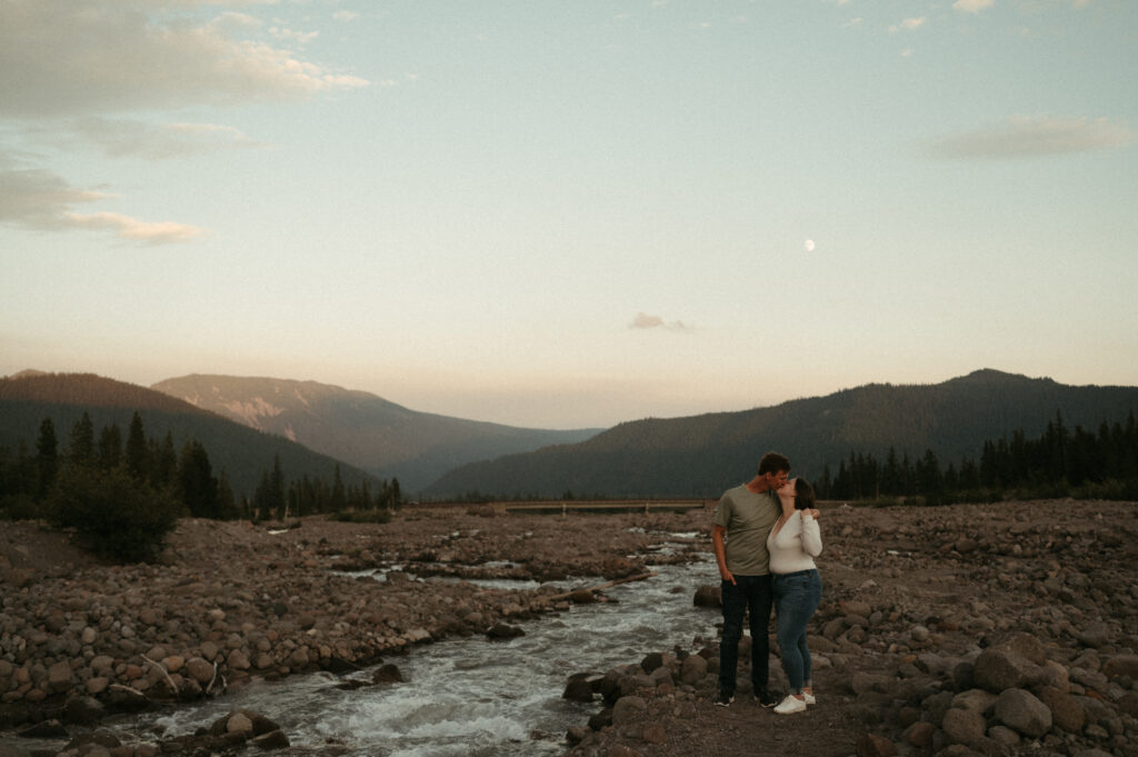 couple kissing with moon in background