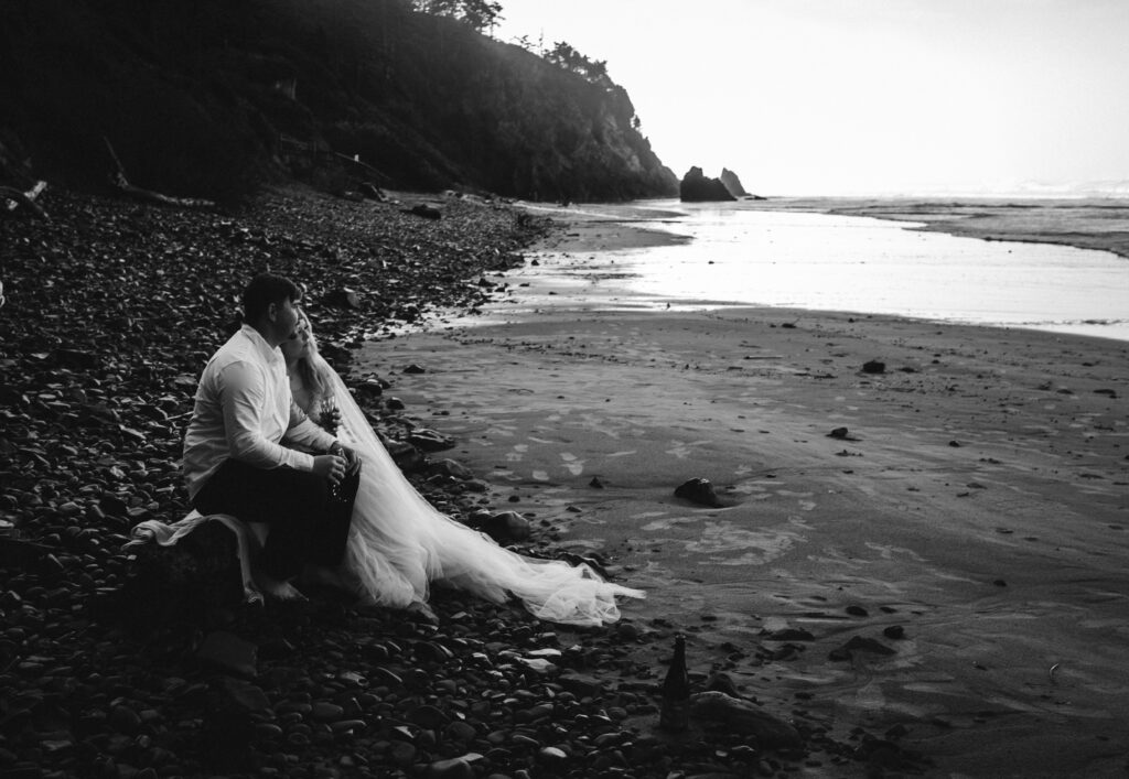 couple looking at the ocean during oregon coast elopement