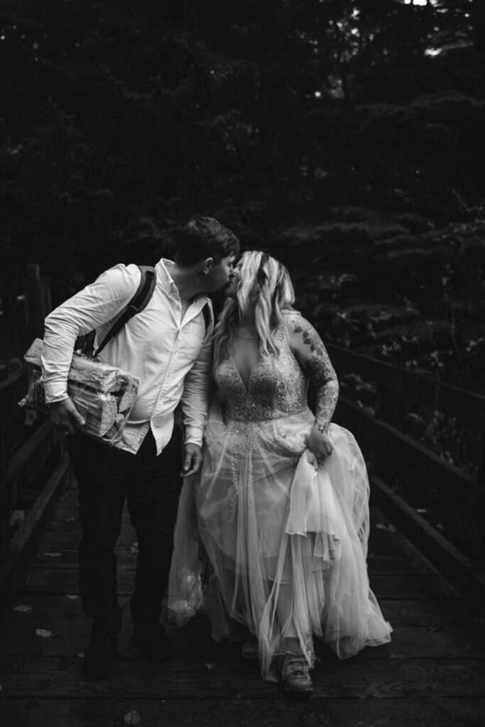 couple hiking on wedding day during oregon coast elopement