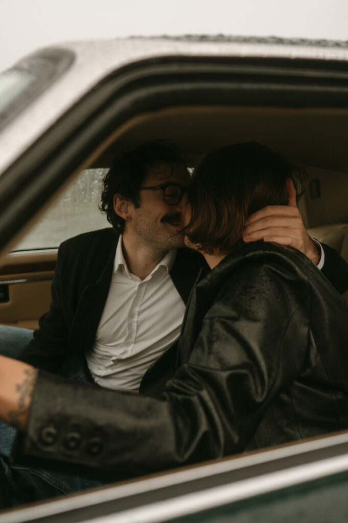 boyfriend pulls girl in for a kiss during their oregon coast couples session