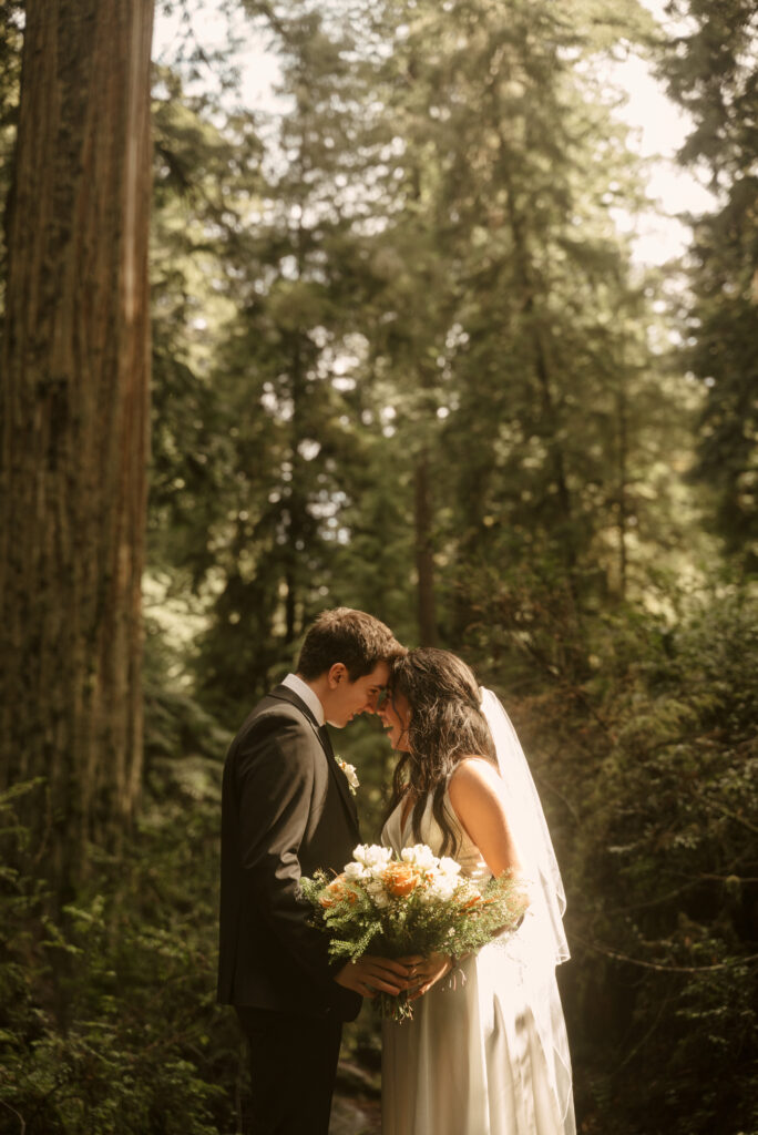 couple laughing during redwoods elopement