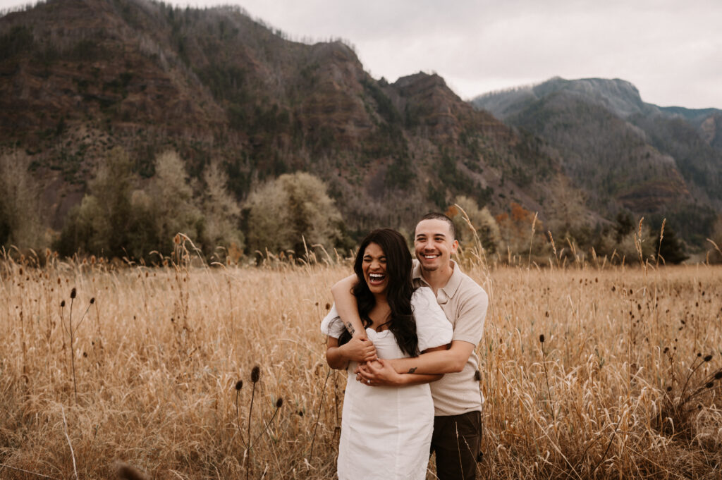 couple laughing during engagement photos in columbia river gorge