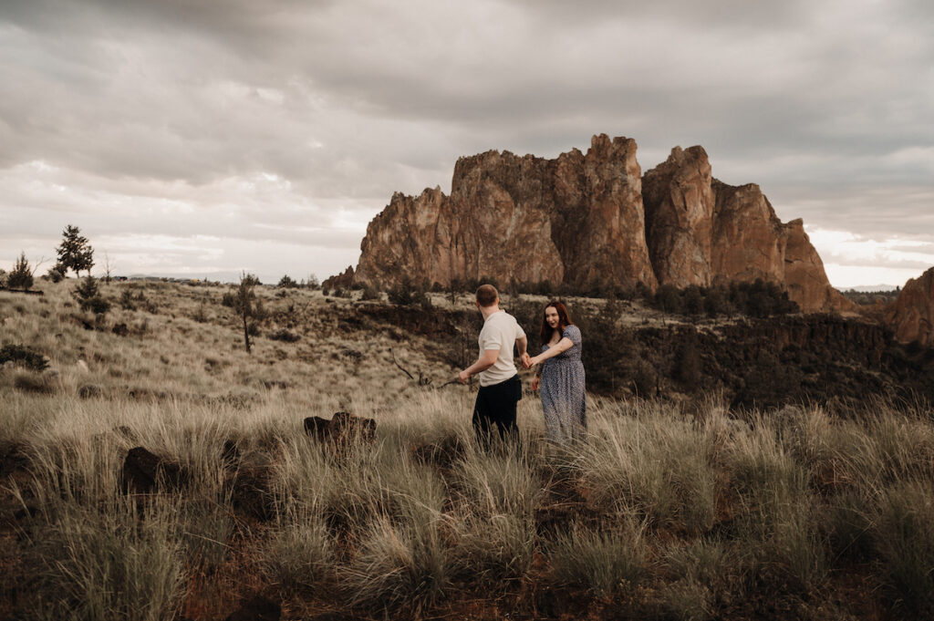 couple walking in sage brush at Smith Rock State Park